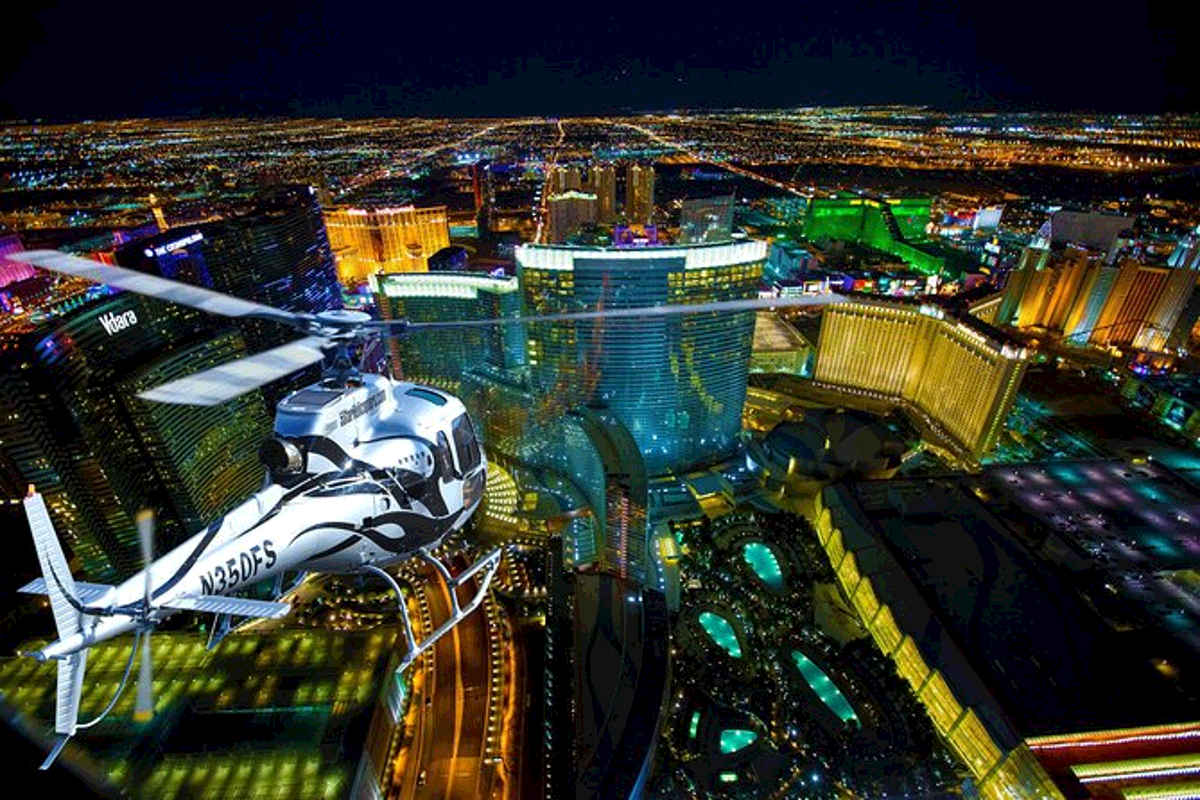A helicopter touring flight at night over the Las Vegas Strip