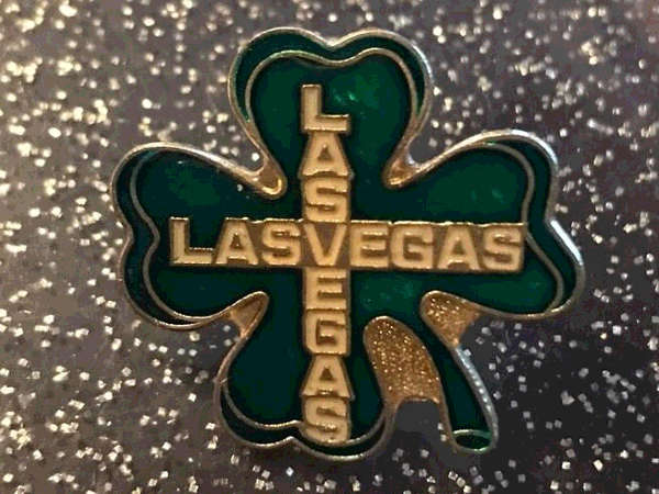 A lucky Las Vegas four leaf clover pin.