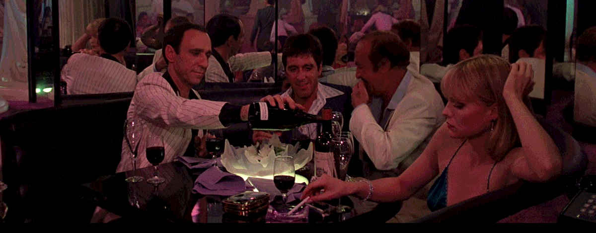 Tony Montana and associates enjoy the night at a reserved table at the club