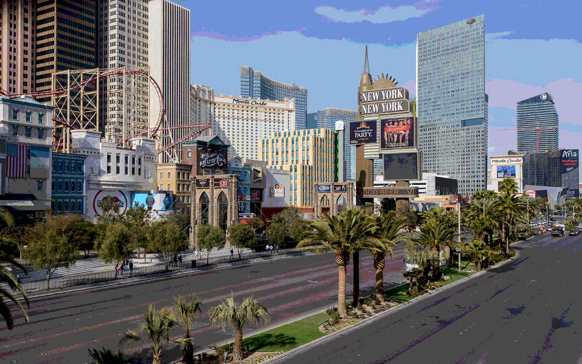A view of the simulated New York city skyline of New York New York Las Vegas, the old Monte Carlo, the Aria, CityCenter, and the Cosmopolitan from a skyway above South Las Vegas Boulevard