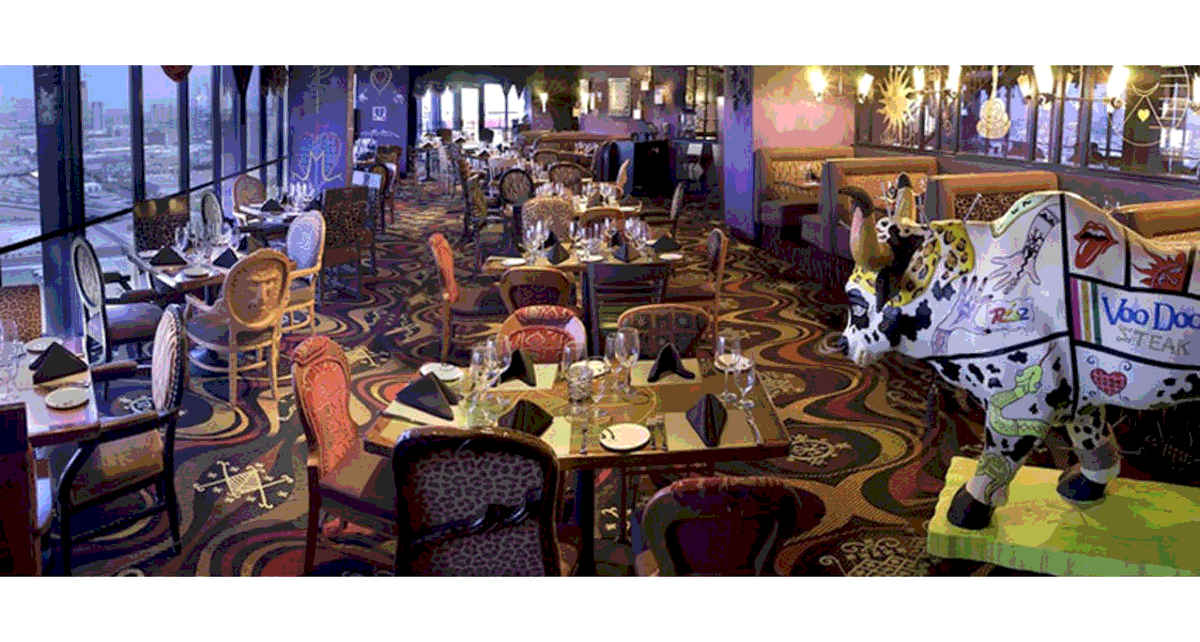 The dining area of VooDoo Steak restaurant has whimsical chairs and a tattooed bull statue