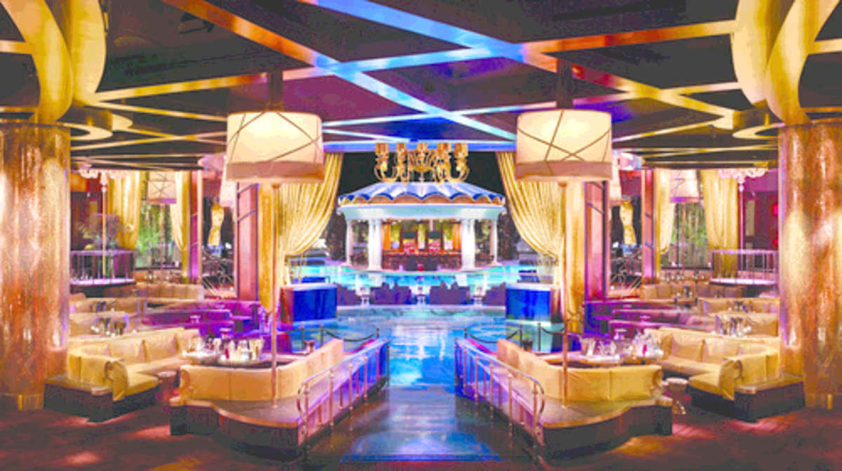 Opulent private tables surrounding the dance floor at XS nightclub